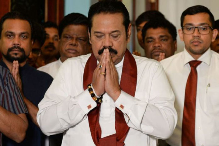 Rajapakse bows out, ending Sri Lanka power struggle